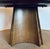 Original retail $7425, stylish Revelation Modern Walnut Finished Round Gold Rush Dining Table, showroom floor sample