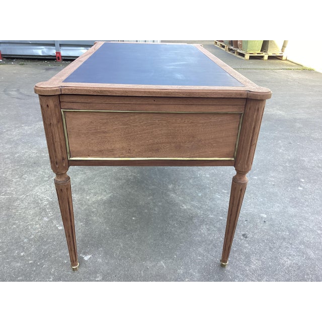 You will love the finish on this Louis XVI style writing desk. This piece has been sanded down to the original mahogany...