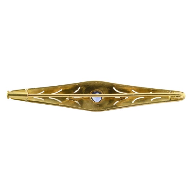 This is part of Chairish’s Fine Jewelry assortment. Vintage Art Deco Ceylon sapphire and VVS1 diamond bar pin, circa 1930....