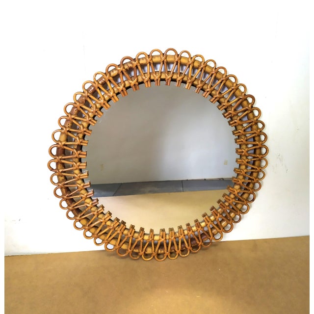 This rattan mirror is attributed to Franco Albini for form and style. No damages. 100% original without defects. Original...