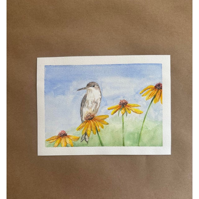 A delicate watercolor featuring a small songbird perched gracefully among golden coneflowers beneath a soft summer sky....