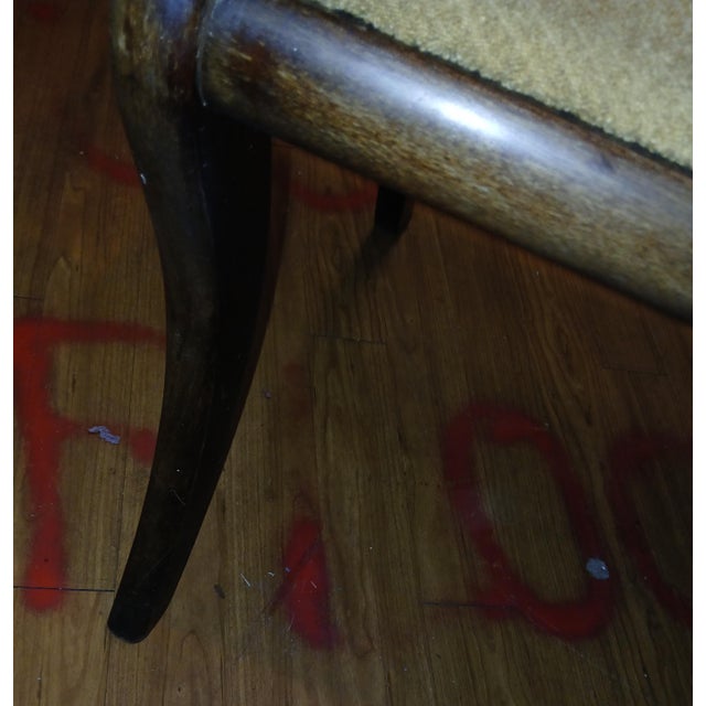 This handsome English Regency mahogany armchair, circa 1820, has scrolling ram’s horn arms and bowed crest and lumbar...