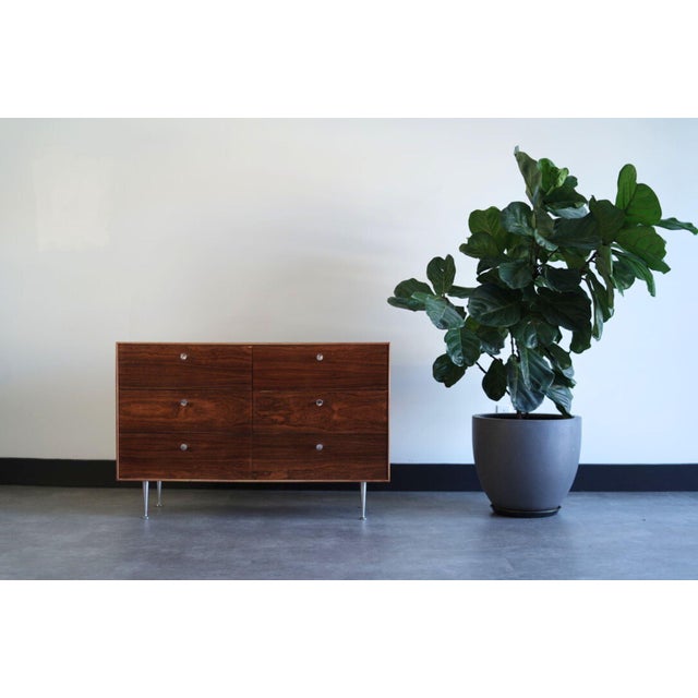 The exquisite Thin Edge Rosewood Dresser by George Nelson for Herman Miller has been meticulously restored by Stamford...