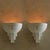 A pair of French wall sconces from the 1930s, shaped by the geometry of the Art Deco period. Each piece is formed in...