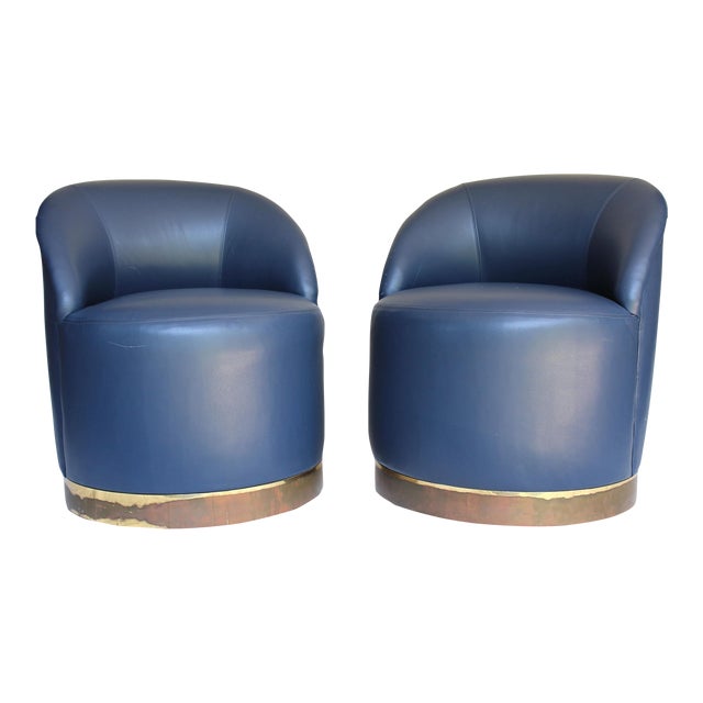 1970s A Pair of Blue Leather Club Chairs on Brass Caster Wheels For Sale