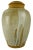 A mid 20th century hand turned clay lidded jar with a lava glazed finish. Signature marked on the bottom of the jar. This...