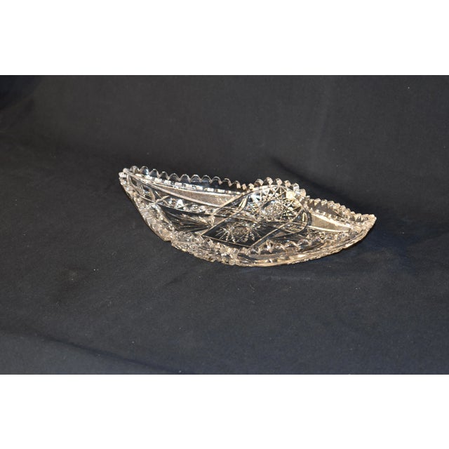 Circa 1920's American cut glass serving dish. Lovely boat like shape with a wonderfully cut pattern and saw tooth edge....