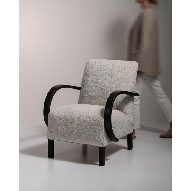 Bentwood-arm lounge chair in Dove Grey. The dove grey surface highlights curved black bentwood open arms, dove grey linen...