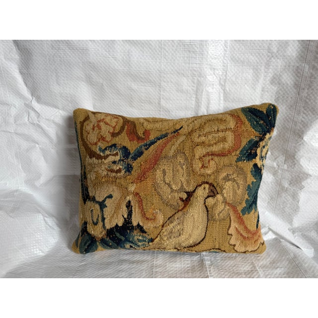 An exceptional antique Flemish Verdure tapestry pillow handcrafted from an authentic 17th-century tapestry fragment,...