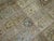 A room size antique Persian Tabriz Oriental rug woven early 20th century with a garden box all over design in earth tones...