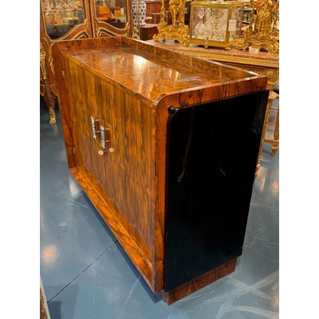 This Early 20th Century Art Deco Style Rosewood Credenza exudes a French charm with its gorgeous and rich rosewood finish....