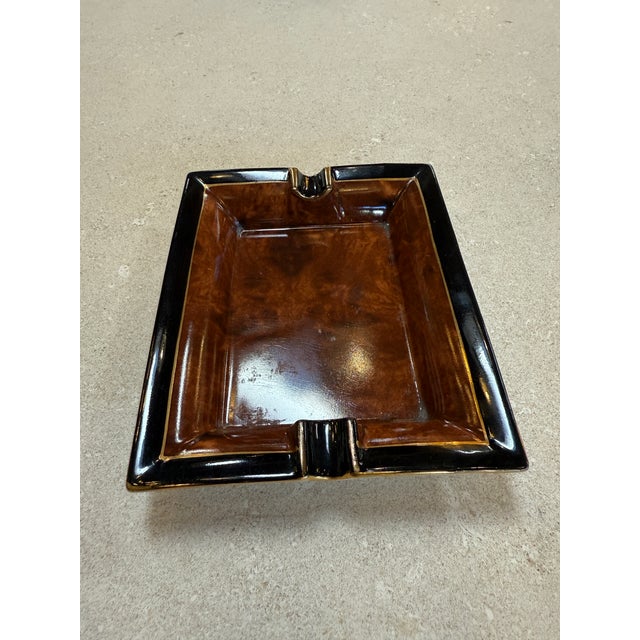 Elegant mid-century Italian ceramic ashtray, dating to the 1970s, characterized by a refined rectangular form with softly...