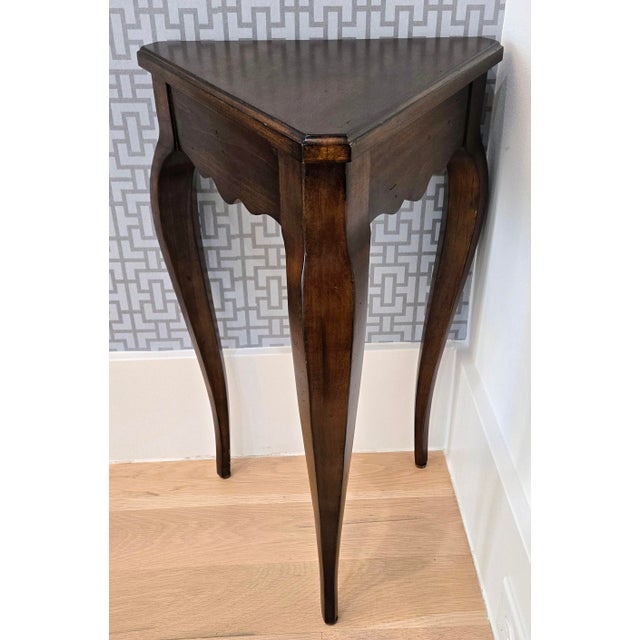 Bring classic French Country charm to a small space with this Ethan Allen Country French walnut triangle corner accent...