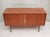 Original 1950s sideboard. Walnut veneer, the interior is veneered in light ash. Lockable double doors. Four trumpet-shaped...