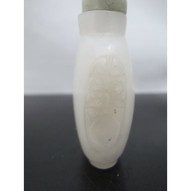 Chinese Carved Masks White Peking Glass Snuff Bottle With Green Top For Sale - Image 4 of 11