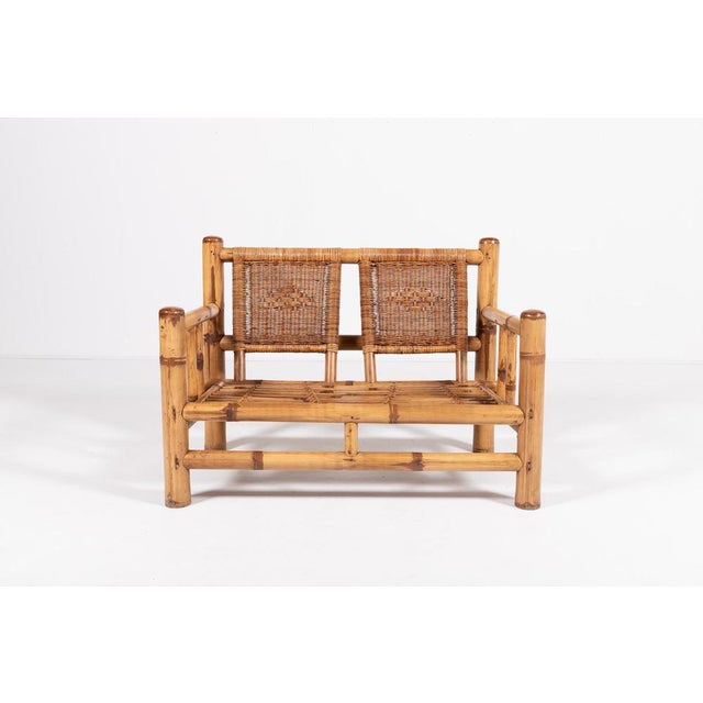 Italian design wicker/bamboo frame sofa-bench produced in 1970’s. The removable cushions are included. I have official...