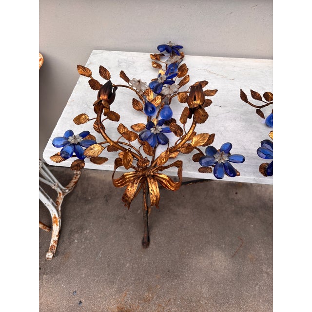 Mid-Century Large Pair of Tole & Crystal Leaves and Flowers Sconces. Blue Crystal Flowers and gold leaves tole. In the...