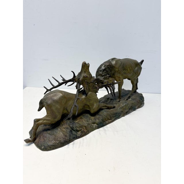 This exquisite bronze sculpture of two fighting stags is a masterpiece by renowned French sculptor Thomas Cartier...