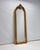 Large gold full-length mirror with ornate ornaments and a decorative crest. Thanks to its long, slender format, this...