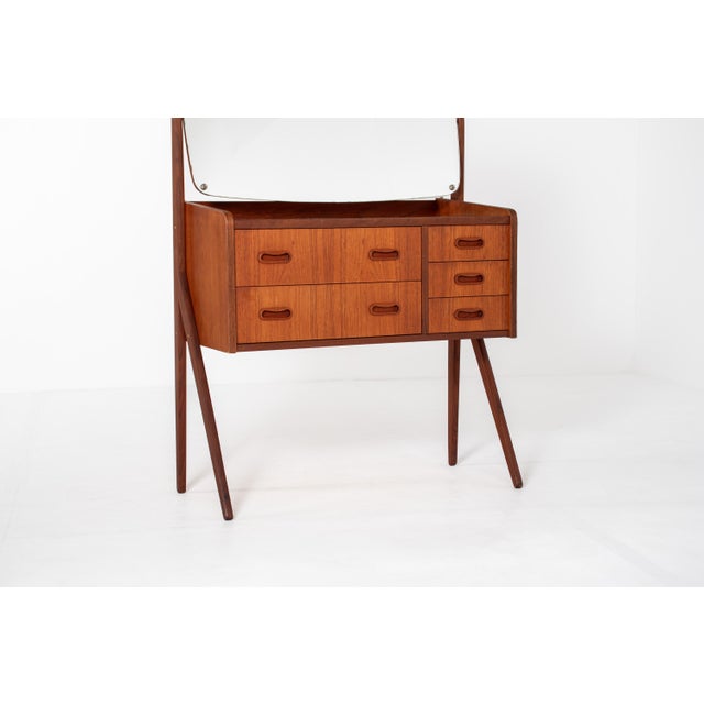 Beautiful Danish mid century modern vanity table from the 1960s. Made of warm teak wood with a rich natural grain and...