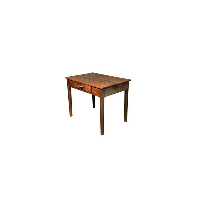 Fir wood writing desk dating back to the early 1900s, featuring a practical drawer. with simple, essential lines, it...
