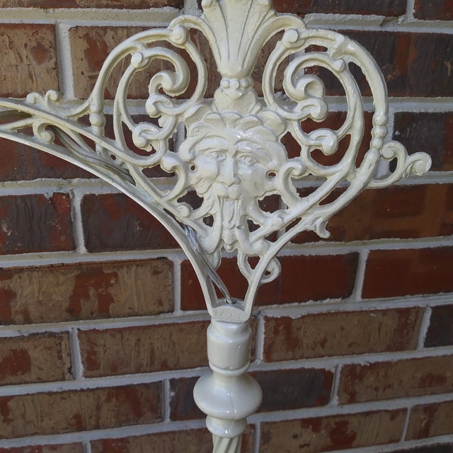 This is a quite unusal cast iron bridge arm lamp with instricate detail unique design. I think this from the art deco or...