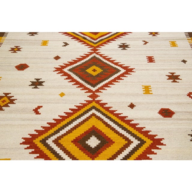 Beautiful Modern Kilim hand-knotted wool rug with multicolor accents in an all-over geometric design. This rug measures...