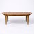 A beautifully proportioned mid-century oval extending dining table by Sutcliffe of Todmorden, showcasing the refined...