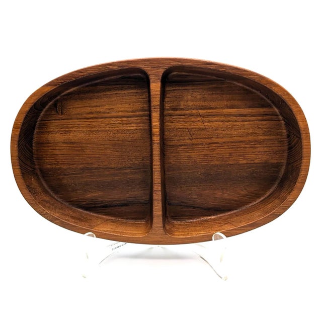 Offered is a circa. late 1950s, early 1960s oval-shaped partitioned nut and snack Teak wood bowl designed by Jens H....