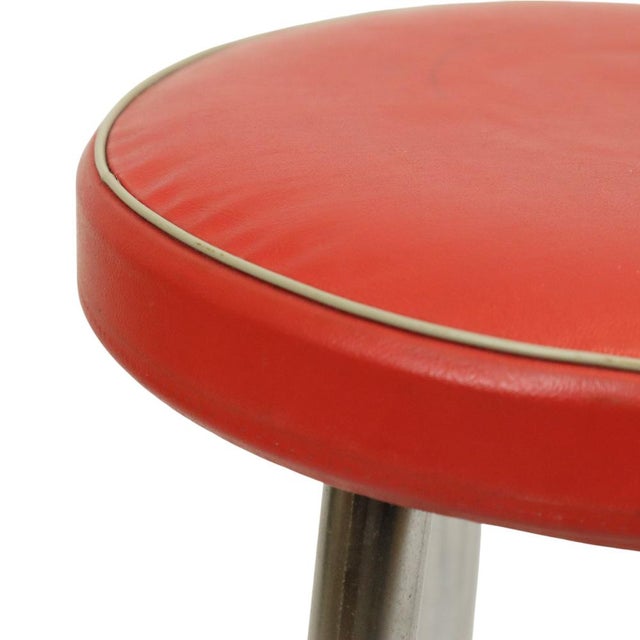Vintage Brabantia stool made of a chrome base and a red round faux leather seat with white piping, 1950s design object,...