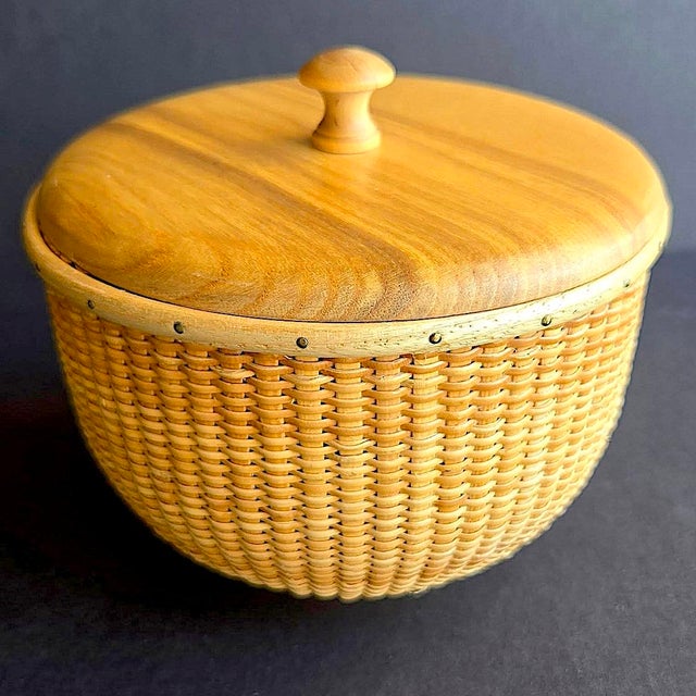 Offered is a Honey Pot Nantucket Basket with wooden lid by American basket designer Nathan Taylor and Basketville. Tightly...