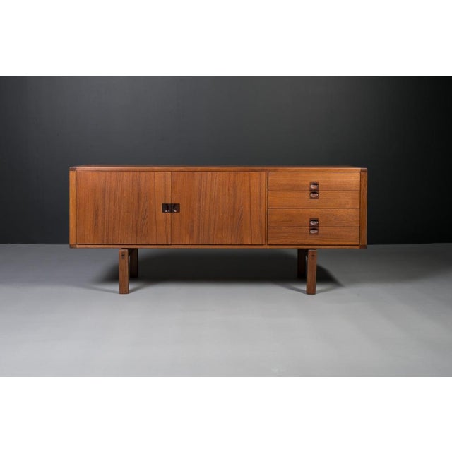 This beautiful teak sideboard seamlessly blends the timeless elegance of scandinavian modern design with the iconic flair...