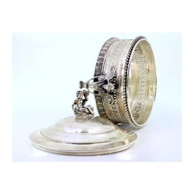 Grid Style Cut Silver Bonbonniere with Pearly Edge Frieze, Angels and Lid Knob, in Very Good conditions. Designed from...