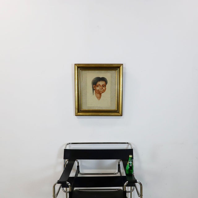 Antique art print reproducing a drawing by Diego Rivera, depicting the portrait of an Indigenous Mexican child, a...