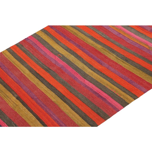 This vintage 5x9 Persian Kilim is a mid-century tribal rug that we believe originates from the Shahsavan tribe. On the...