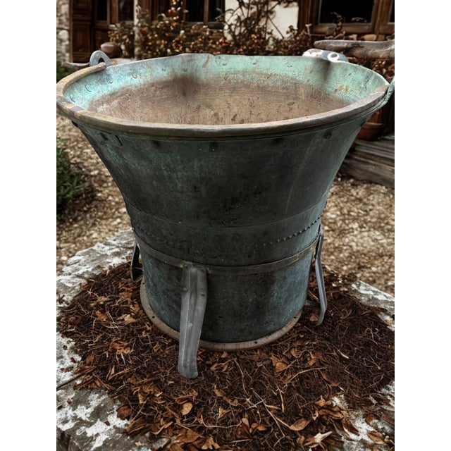 A remarkable piece of rural industrial heritage, this oversized hand-hammered copper cauldron dates to the late 19th or...