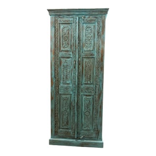 Antique Blue Hand-Carved Armoire With Brass Studs – Floral Statement Bedroom Cabinet For Sale
