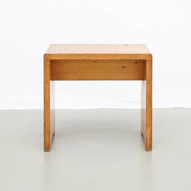 This stool made of pine was designed by Charlotte Perriand for Les Arcs ski Resort, circa 1960 and was manufactured in...