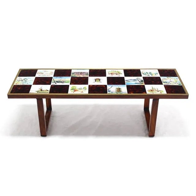 Very nice art tile coffee table top frame in brass "frame" banding around the edge. Perfect for a modern home.