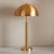 Illuminate your space with a touch of sophistication featuring the Harvey metal dome table lamp in gold. Crafted from...