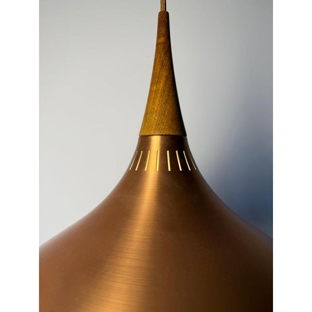 The iconic "orient" pendant lamp, designed by jo hammerborg for the danish manufacturer fog & mørup, features a...