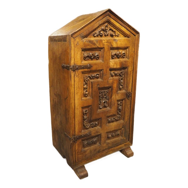 Unusual Circa 1650 Solid Walnut Carved Single Door Cabinet From Spain For Sale