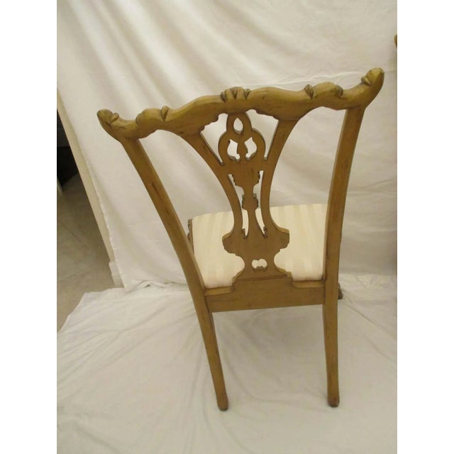 Set of four Chinese Chippendale dining chairs with cream striped original upholstery in good condition.