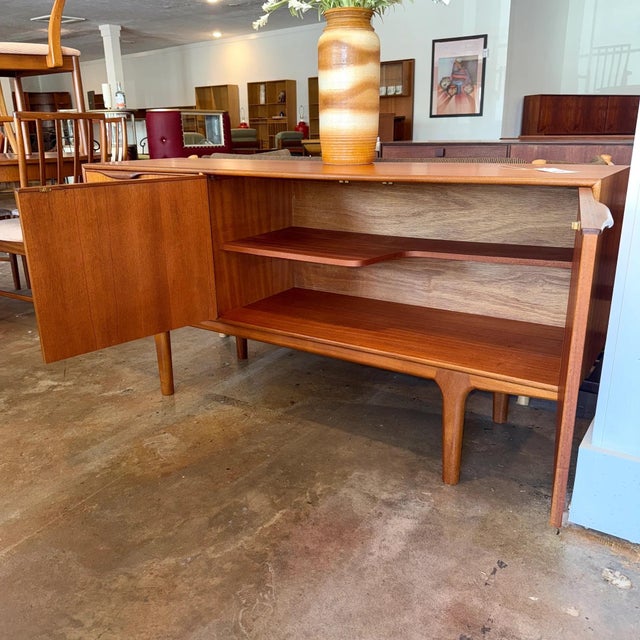 Vintage mid-century modern teak sideboard or credenza designed by Tom Robertson for A.H. McIntosh of Kirkcaldy, Scotland....