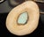This necklace features a natural bone pendant inlaid with a very clean robins egg blue turquoise stone, suspended on a...