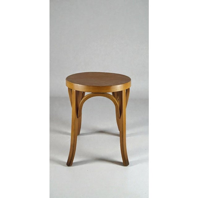 Baumann Stool 1950s Baumann stool produced in the 1950s. Square section wooden frame. Height 47 cm Diameter 36 cm This...