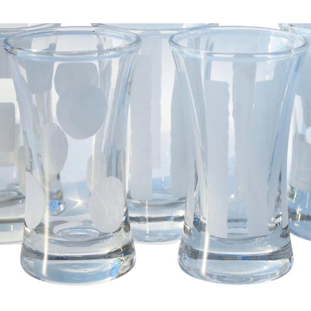 Set of five vintage shot glasses with a pattern of frosted stripes, squares, and circles. No maker's mark. This beautiful...