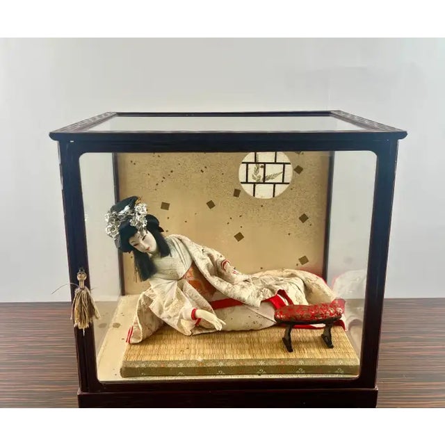 This exquisite antique Japanese Geisha doll is a beautifully preserved example of traditional craftsmanship, elegantly...