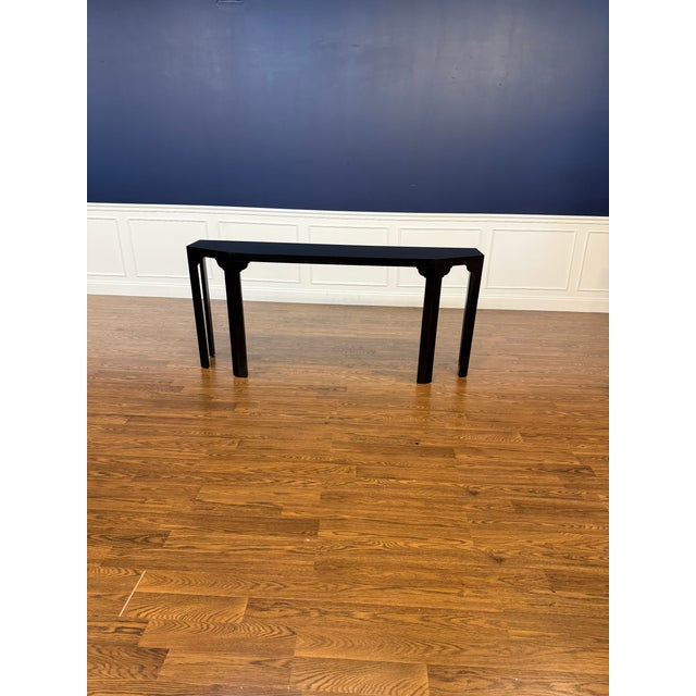 This is the Martin Console Table by Highland House. It has a contemporary design with a satin black finish. We estimate it...