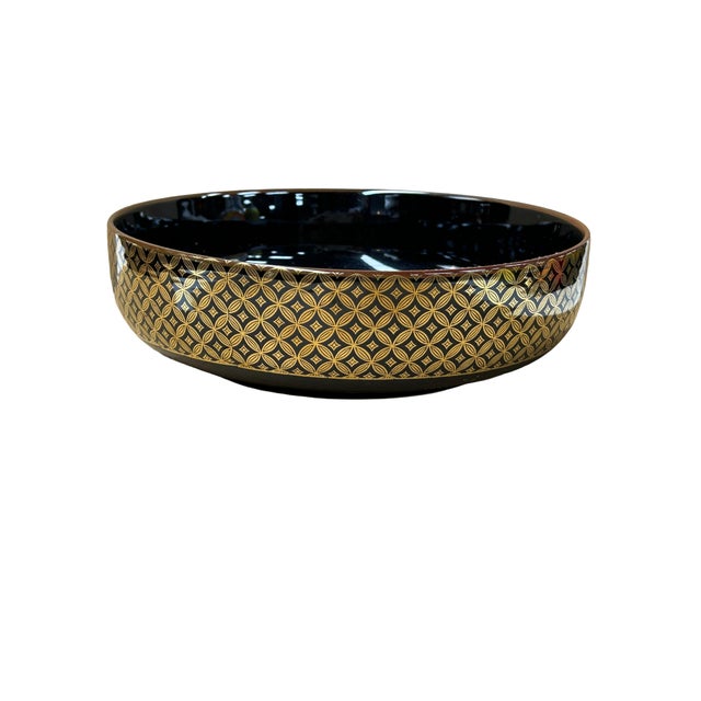 This exquisite Japanese black porcelain bowl, likely a Meiji-period style kashibachi (sweets bowl), showcases the pinnacle...